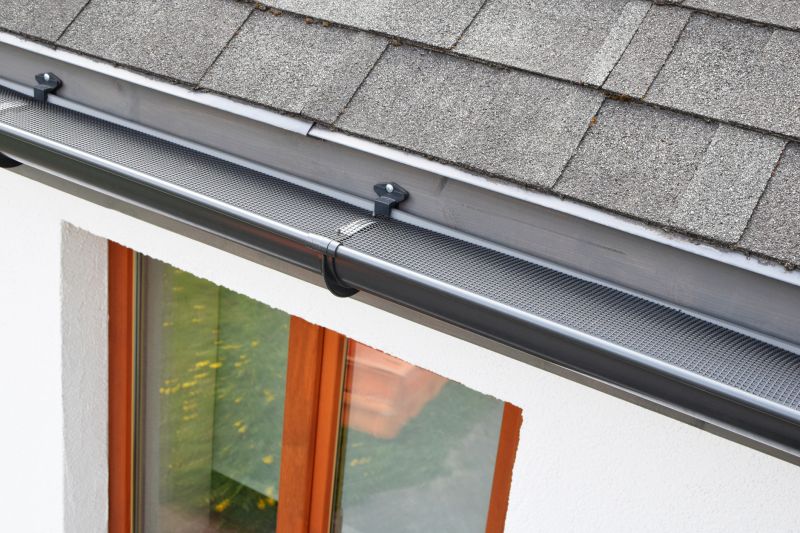 Gutter system with leaf guard
